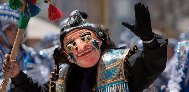Person with mask dancing in the framework of the Virgen de la Candelaria Festival.