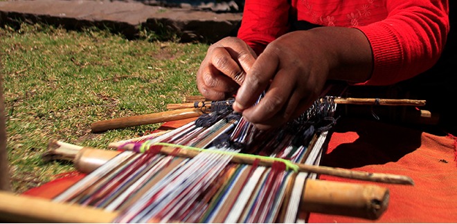 Traditional Taquile textiles reflect Inca agricultural cycles and community rituals